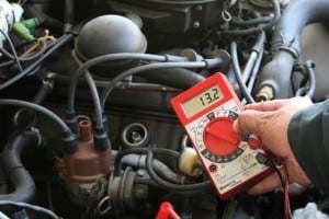 mechanic doing engine compression test